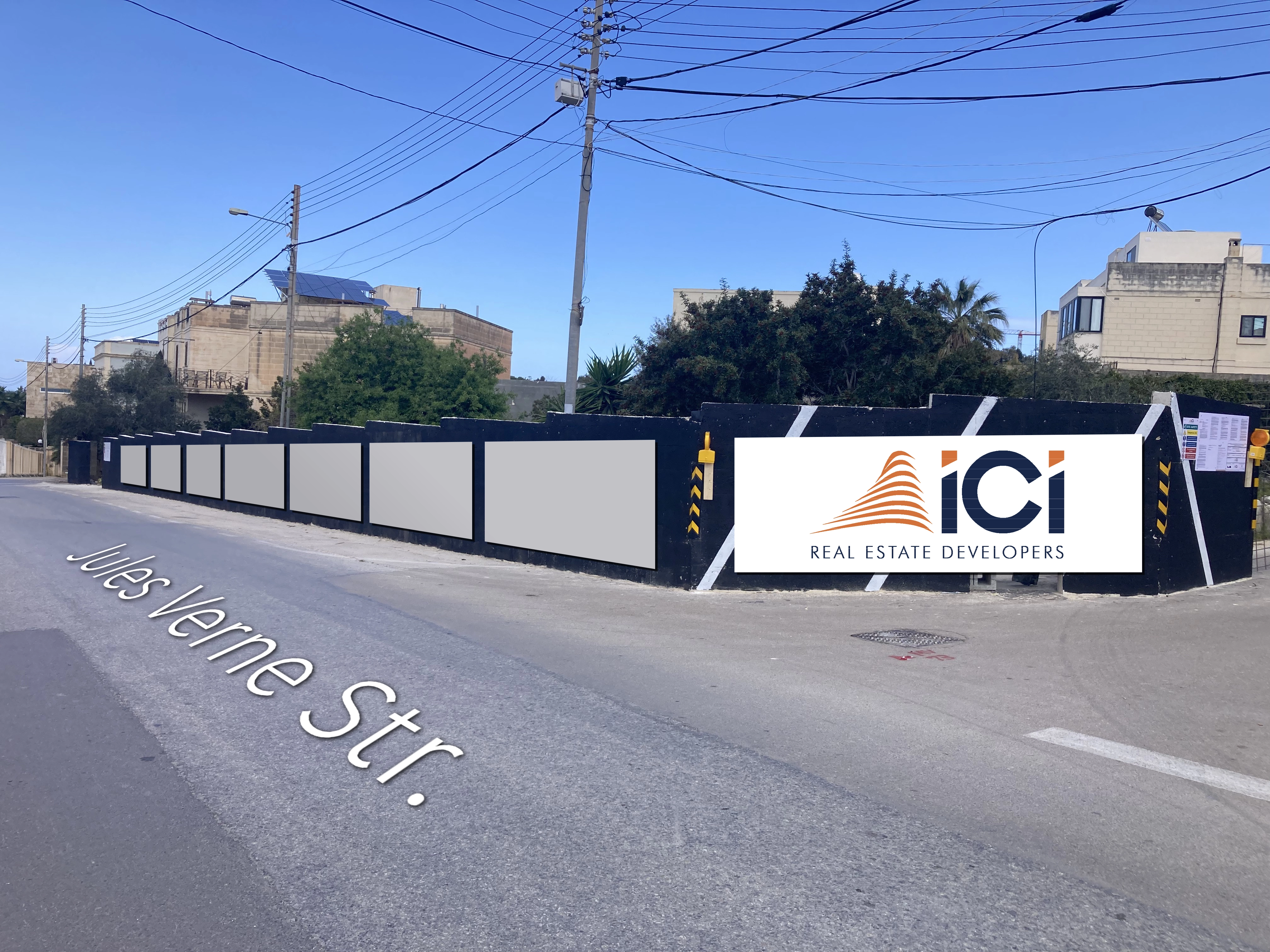 Outdoor advertising strip along Jules Verne Street in San Pawl tat-Targa, Malta, showcasing high-visibility billboard spaces for daily commuters